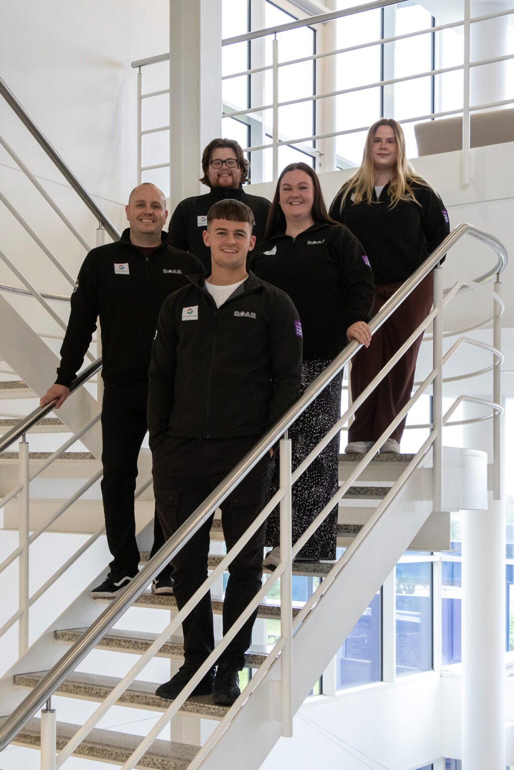 Michael Knowles, left, with staff members at ROAR Digital Marketing (1)